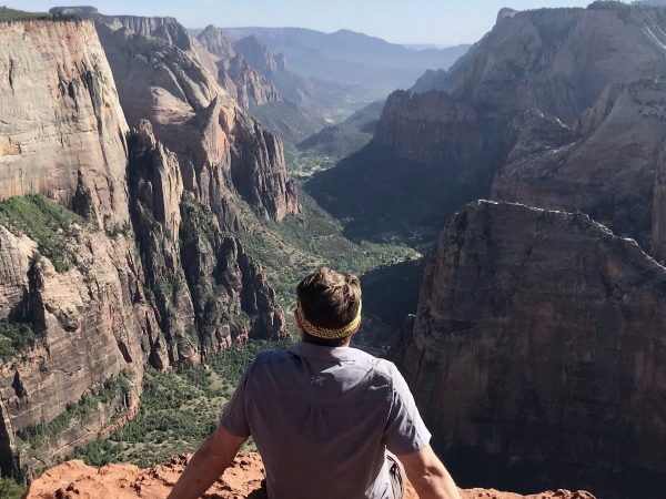 jake haupert reflecting over a canyon, emrbacing transformational travel