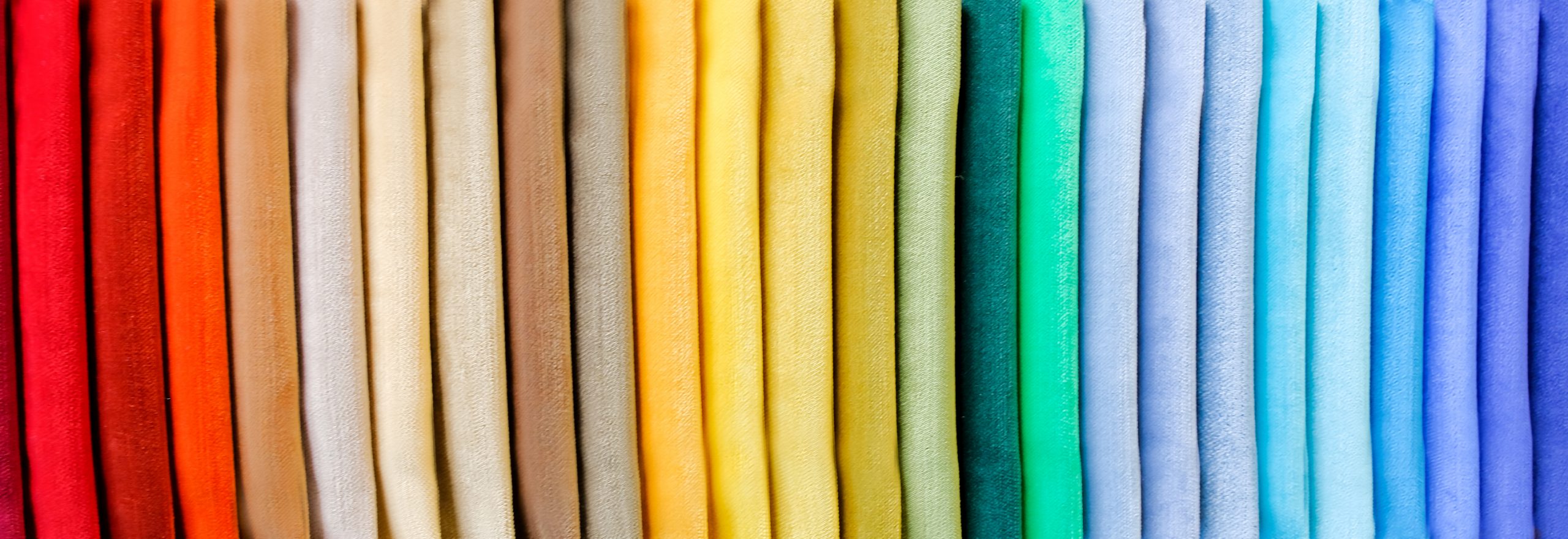Pile of rainbow folded clothes