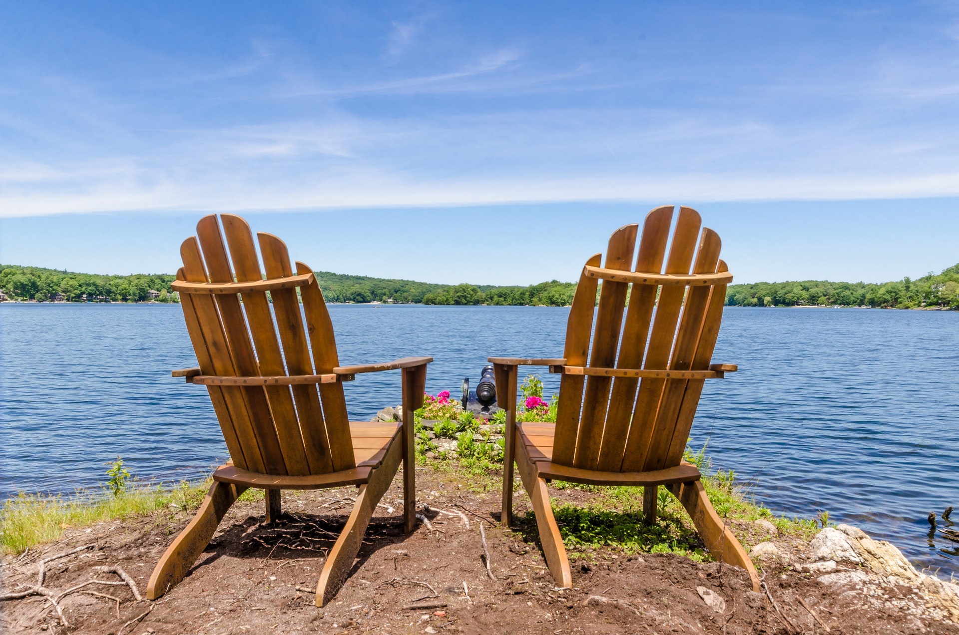 Adirondack chairs with a lake view