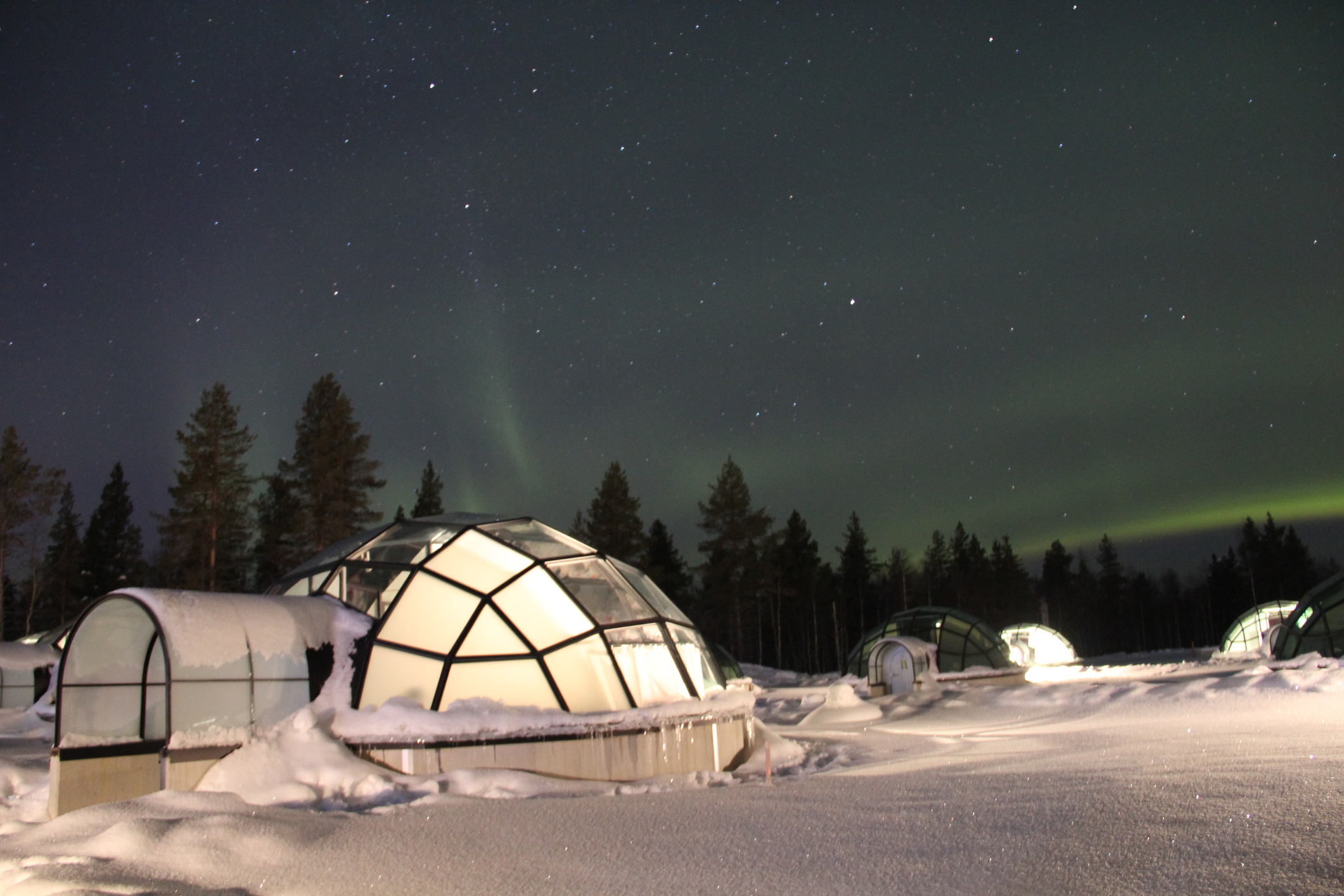 Northern Lights over Glass Igloos in Finland