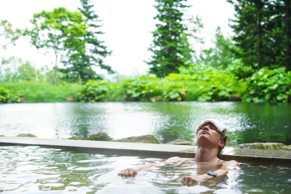 man in hot spring water hokkaido japan